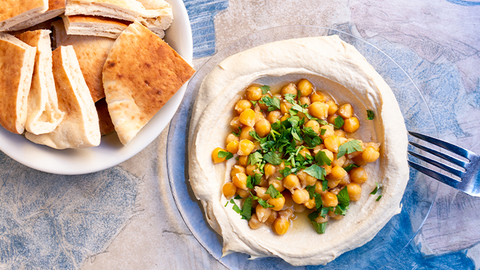 Chickpeas and bread served on a table