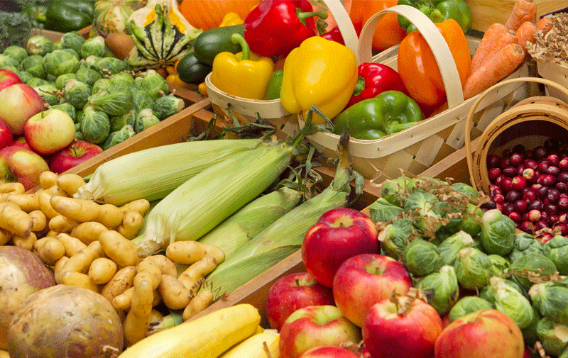 Brightly colored fruits and vegetables in baskets