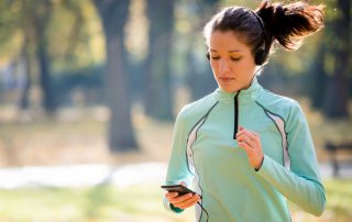 Woman jogging while listening to music