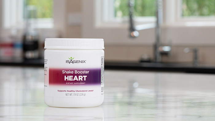 A canister of Heart Shake Booster on a countertop