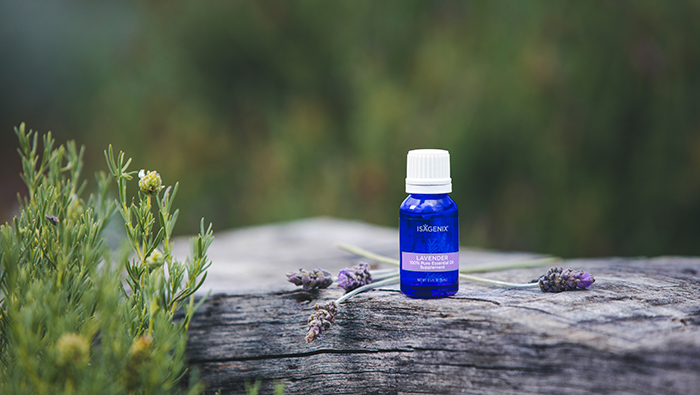 Isagenix Lavender Essential Oil bottle with lavender.