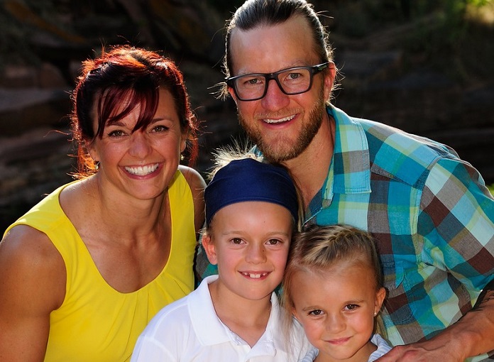 Kayla Johnson with her husband and two daughters.