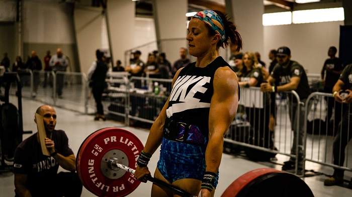 Kayla Johnson powerlifting at a competition.