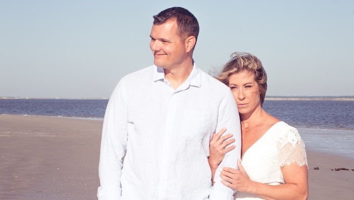 Christie Nix with her husband at the beach - healthy changes