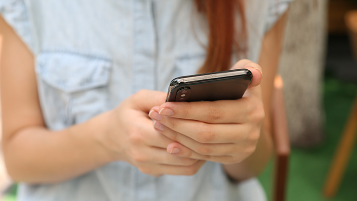 woman holding smartphone