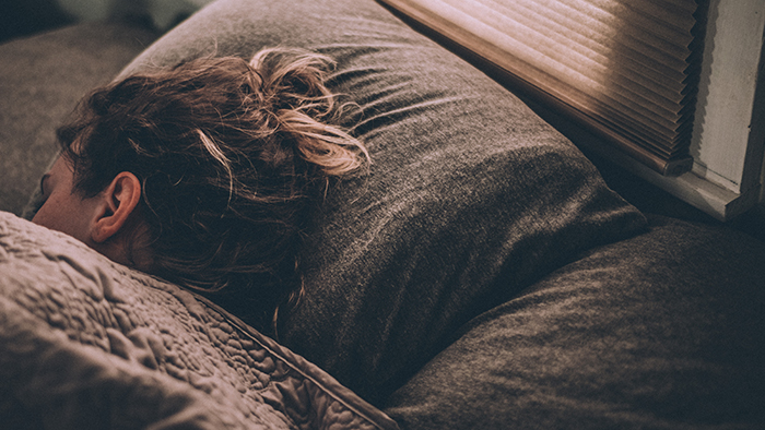 woman sleeps in bed