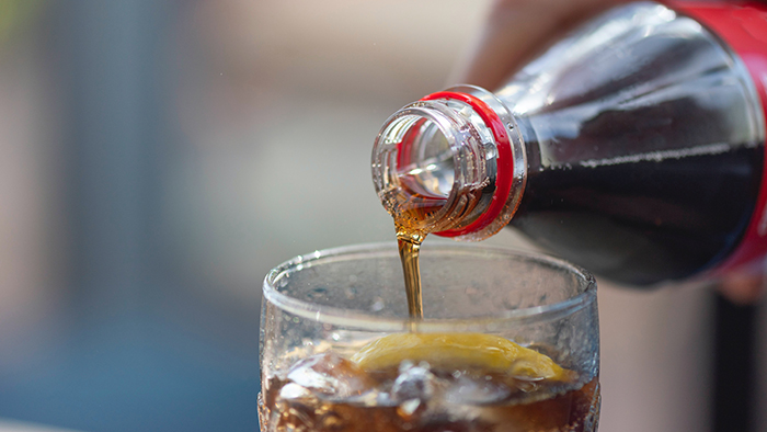 pouring soda over ice