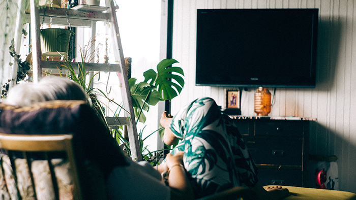 woman watching a documentary