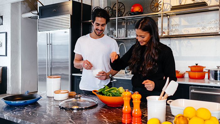 man and woman in the kitchen