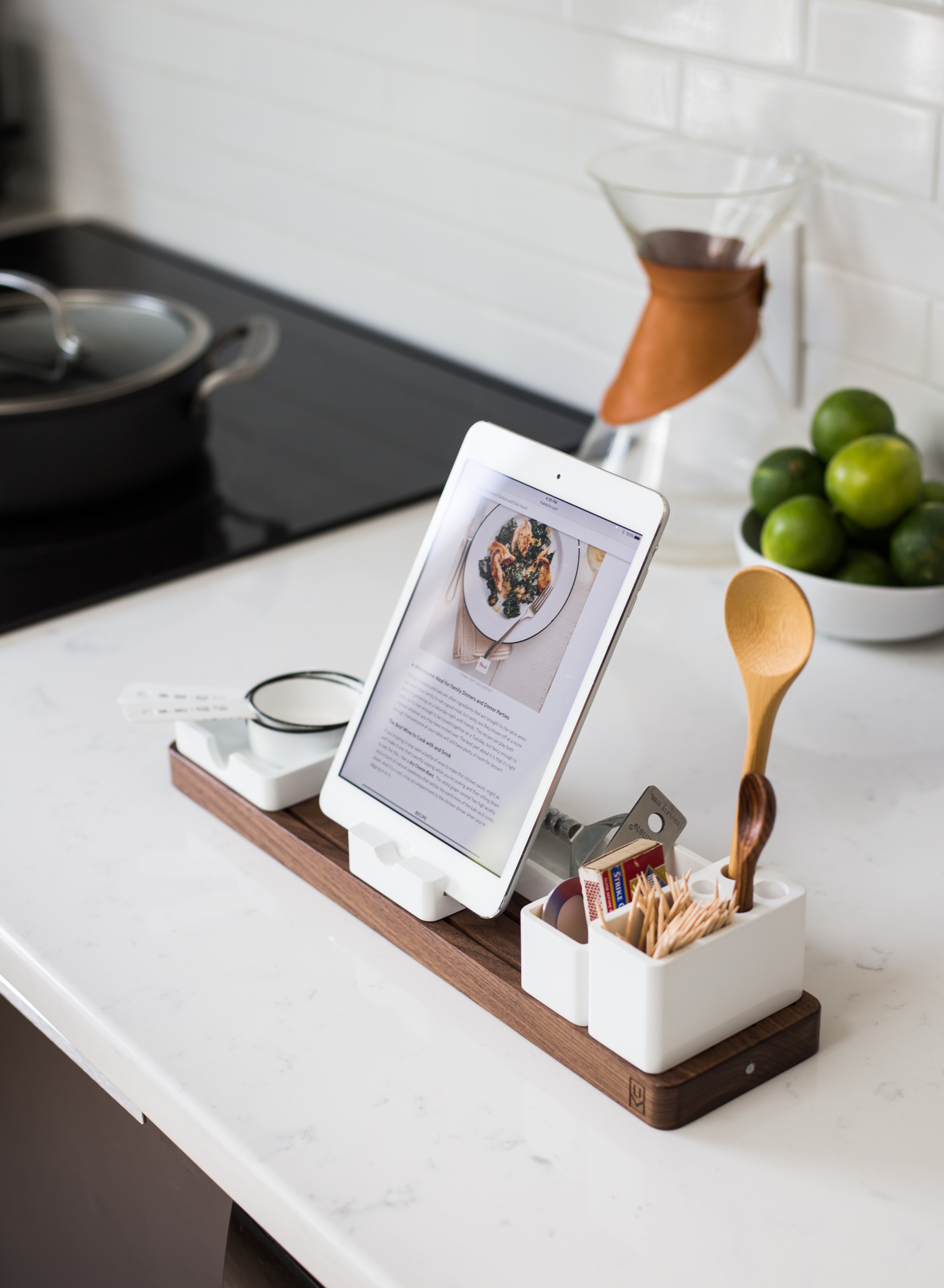 A mobile tablet with a recipe displayed in the kitchen