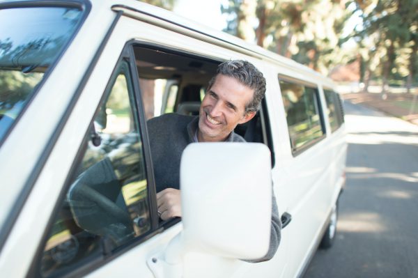 Man leaning out of van window
