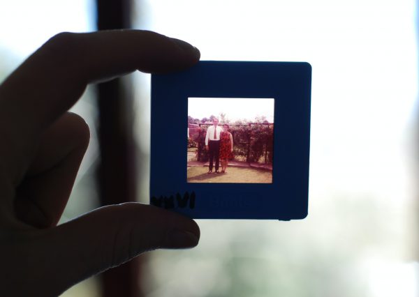 Person holding photo slide