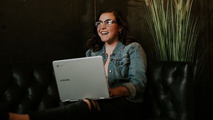 Woman smiling with laptop