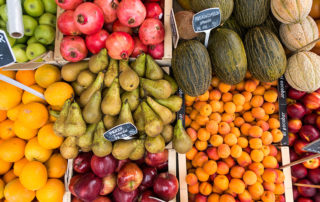 Fresh produce in grocery store bins