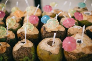 Coconuts with straws and umbrellas