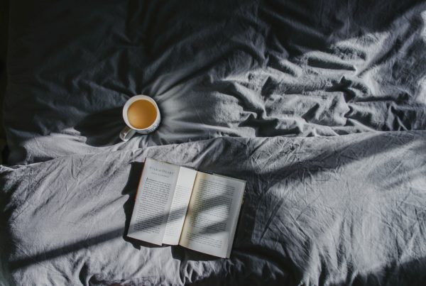 Lazy Day - Book and Coffee on Bed