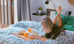 Lazy Day - Girl Having Breakfast in Bed