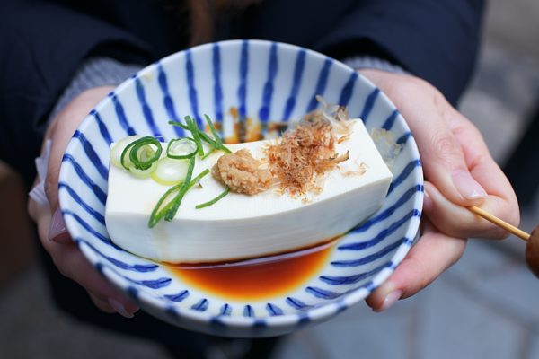 Large tofu piece in a decorative bowl