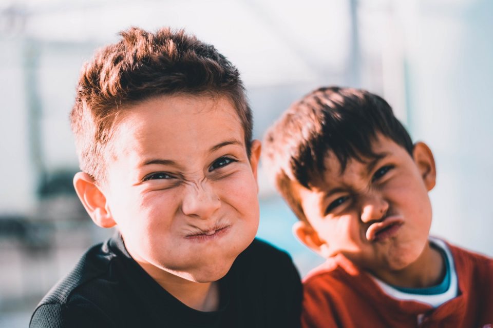 Two boys making funny faces at the camera