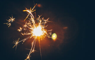 Firework sparkler against a black background