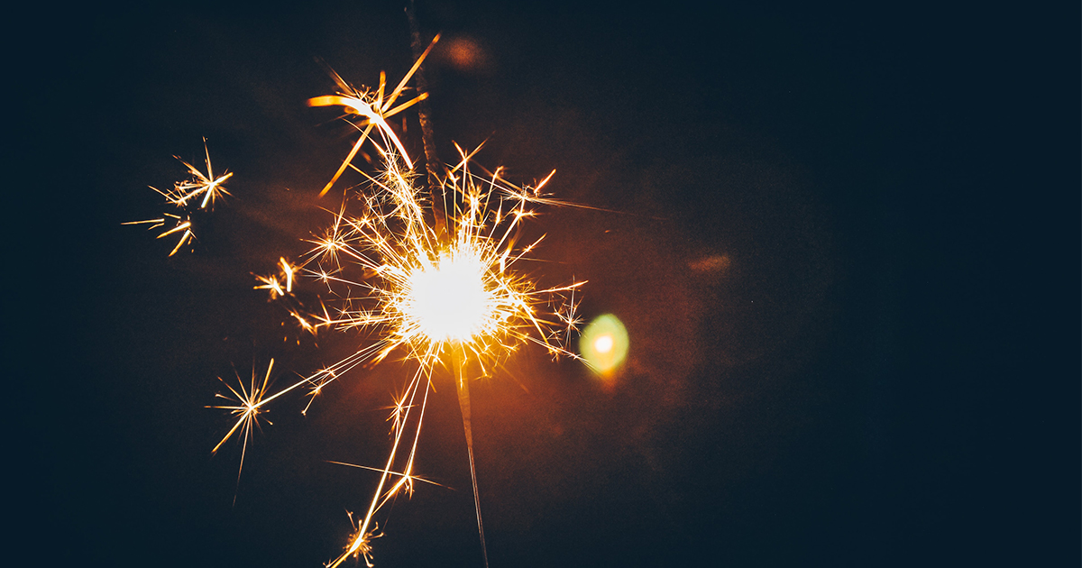 Firework sparkler against a black background