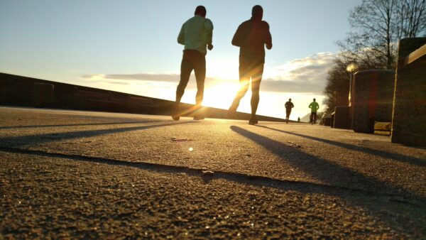 Guys running into sunset